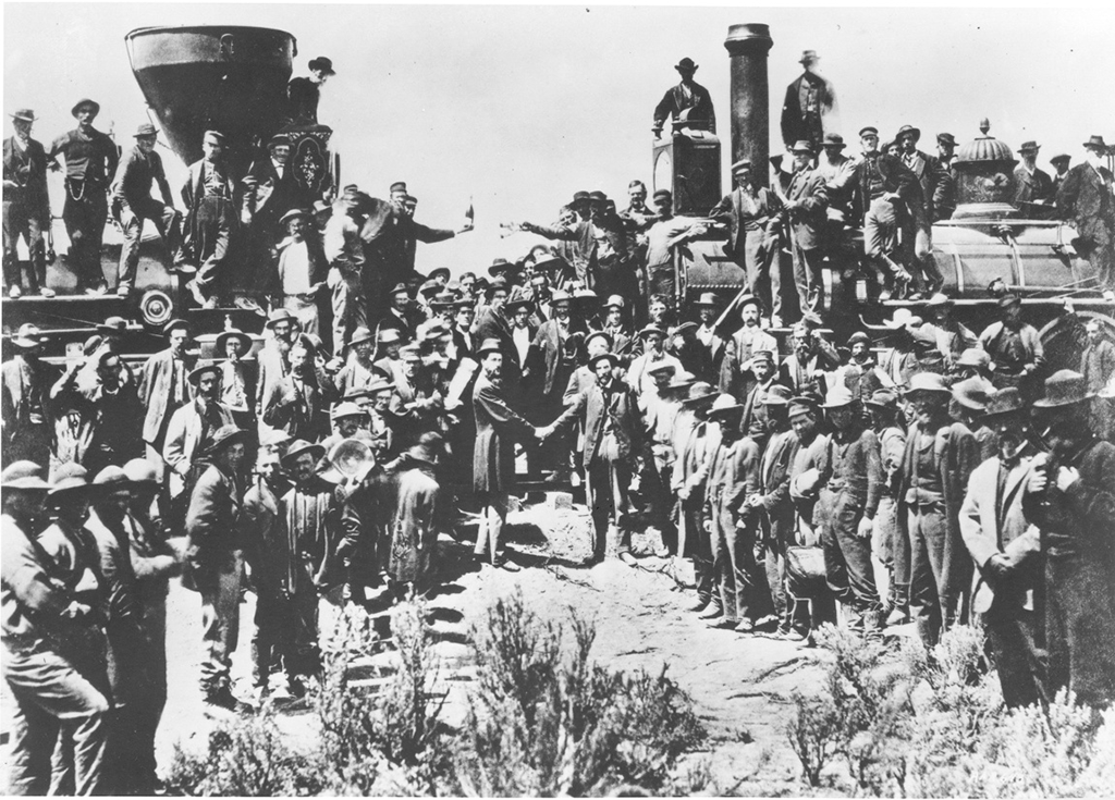 Railroad workers gathered in front of the driving of the golden spike